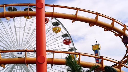 Carnival Rides Operating In An Amusement Park 