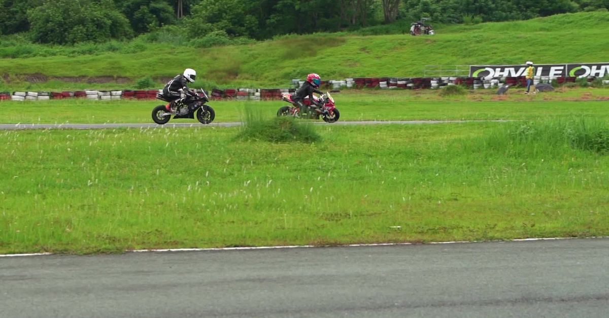 Motorcycle At Races Exciting Motorcycle Race on a Scenic Track Free Stock Video Footage ...