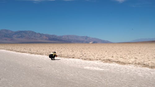 Woman Resting On The Road Along The Desert