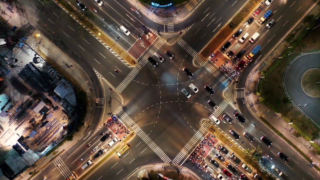 From Above Footage Of Vehicular Traffic On A Busy Street Intersection ...