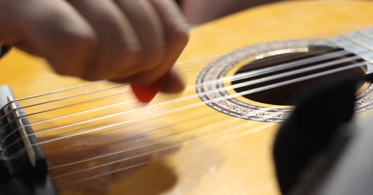 Strumming The Strings Of A Guitar With The Fingers · Free Stock Video