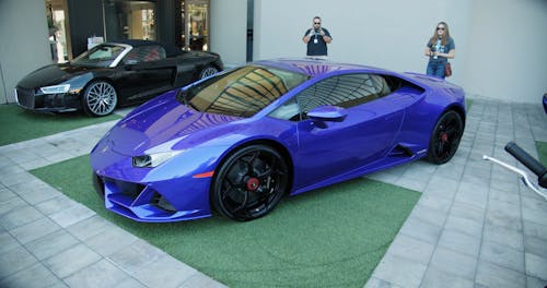 A Luxurious Sports Car On Display In A Car Show