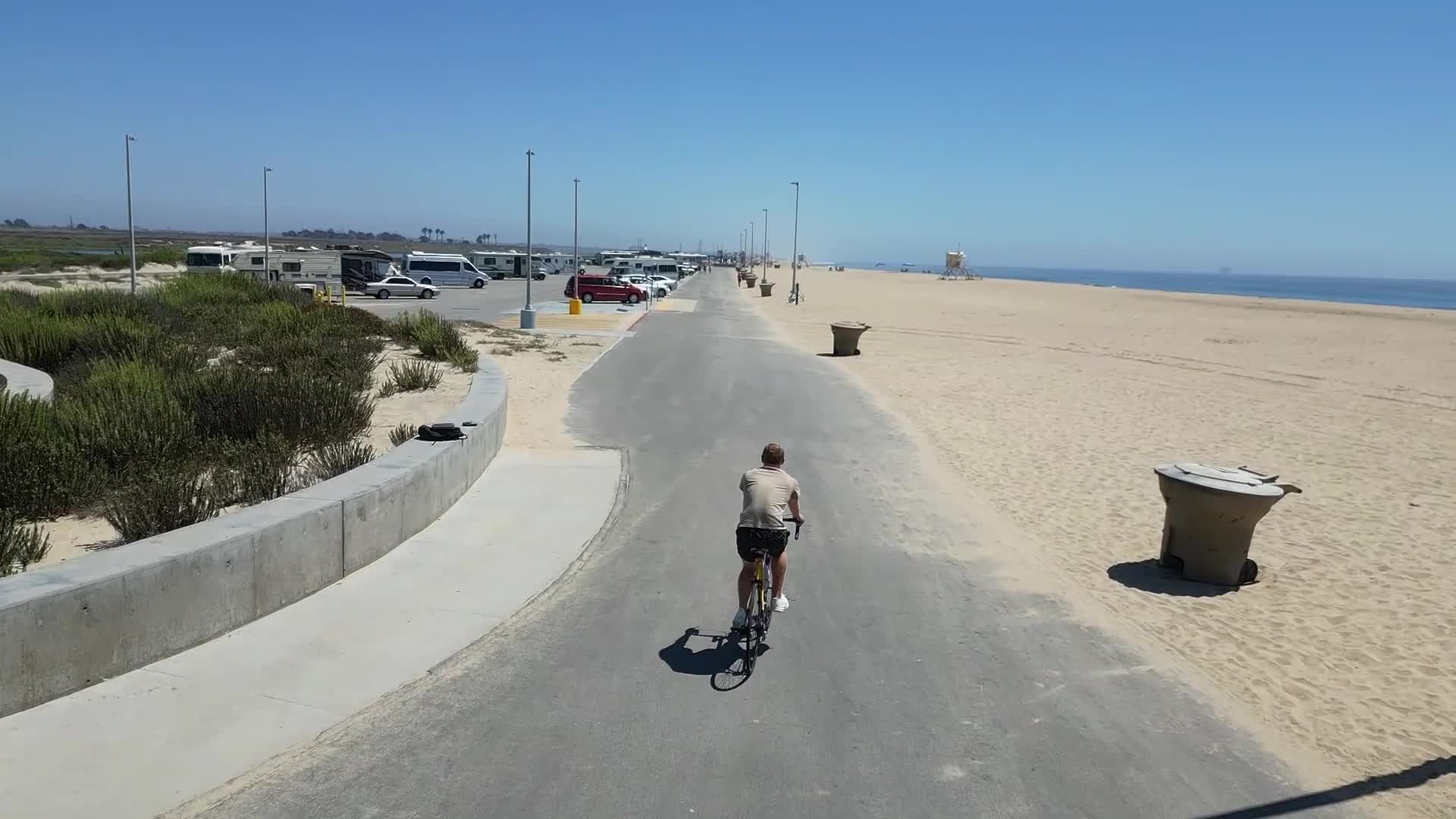 Aerial View of Cyclist on Scenic Beach Path Free Stock Video Footage ...