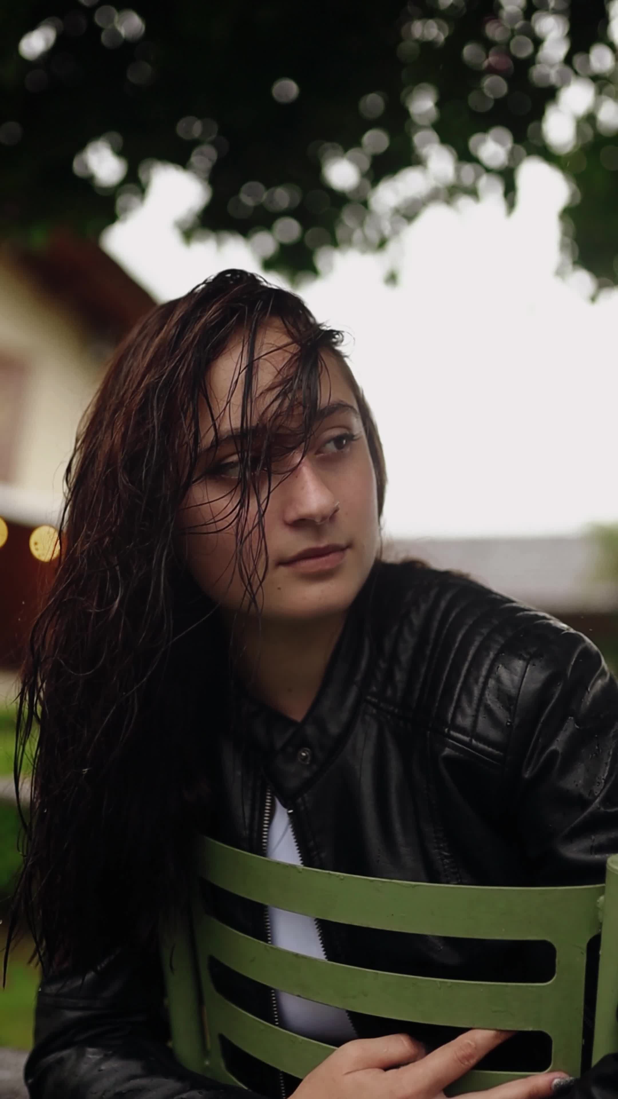 young woman in leather jacket on park bench 30775898 — free pexels stock footage