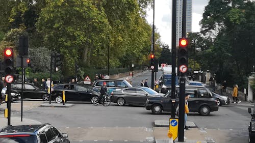 Vehicular Traffic And Pedestrian Traffic At A Road Junction Of A City Street Intersection