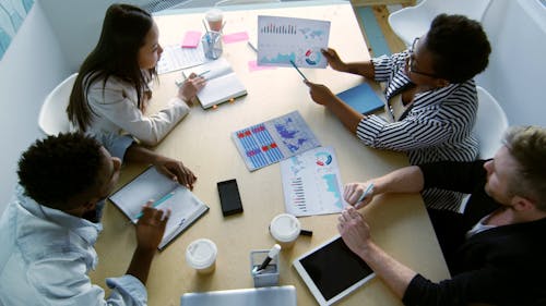 Woman Discussing To Her Colleagues