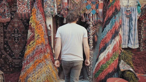Man Entering A Store Of Textiles And Souvenirs