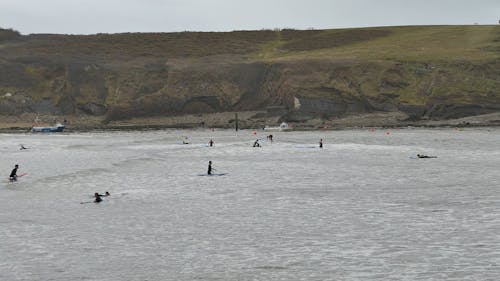 Surfers On The Beach