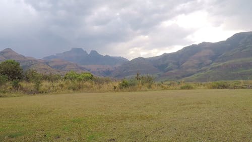 Scenic View Of The Mountain And Clouds From A Valley