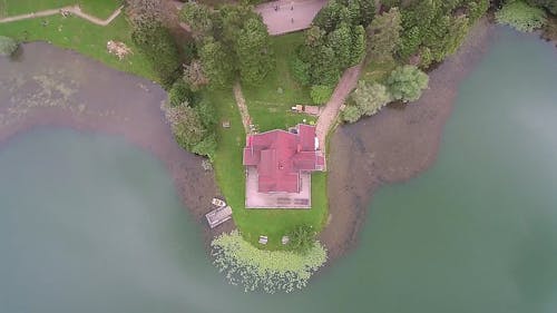 Drone Footage Of A House In An Island By The Lake