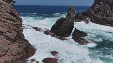 dramatic coastal cliffs and turquoise waves