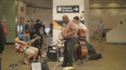 A Musical Band Performing On The Subways Platform
