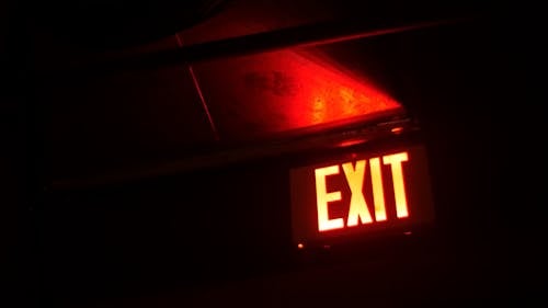 A Lighted Exit Sign For Direction