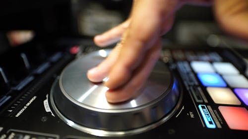 A Disk Jockey Showing His Skills On Scratching 