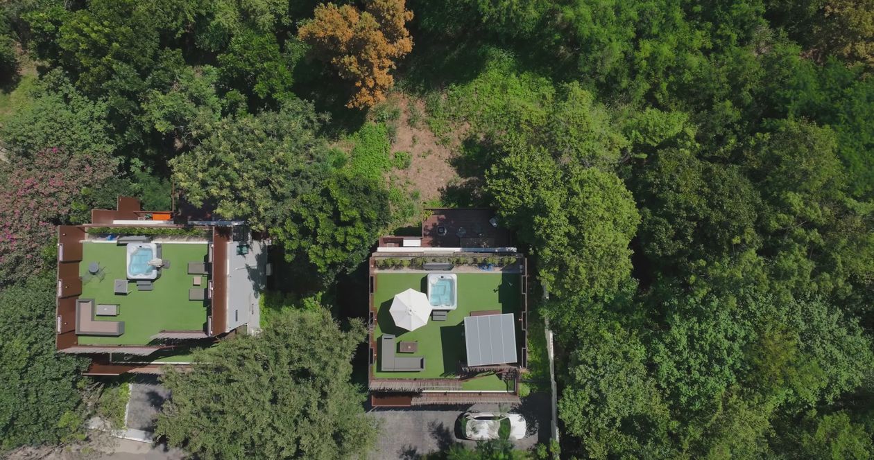 Aerial View of Green Roofed Houses in Forest Free Stock Video Footage ...