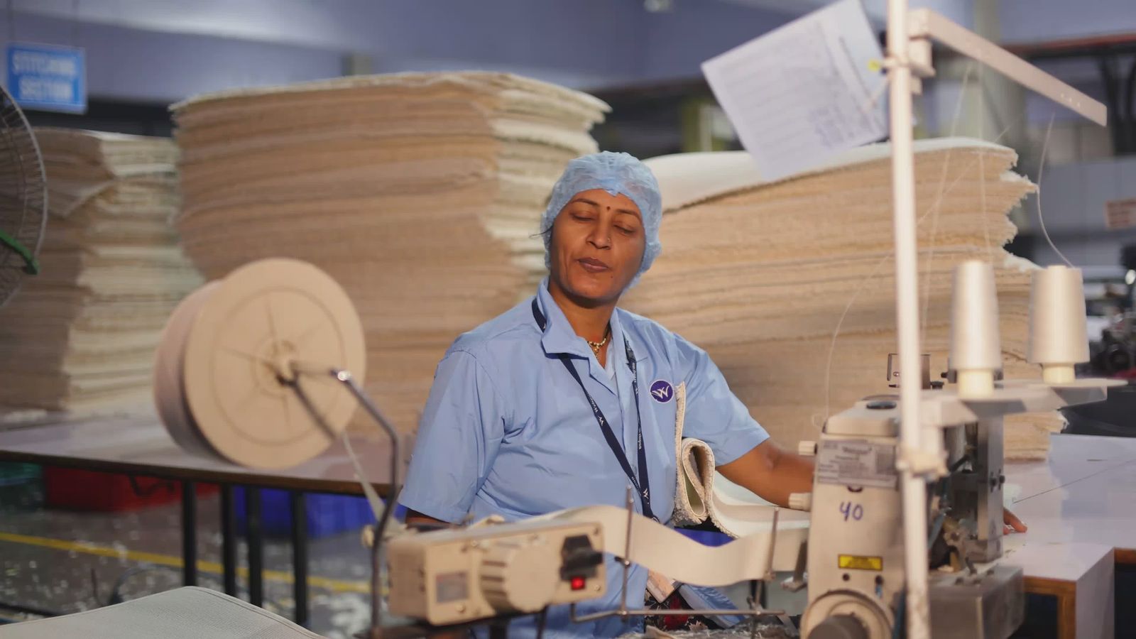 Female Factory Worker Operating a Sewing Machine Free Stock Video ...