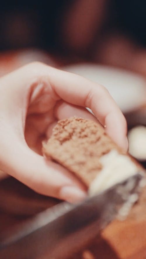 Spreading Butter On A Piece Of Bread