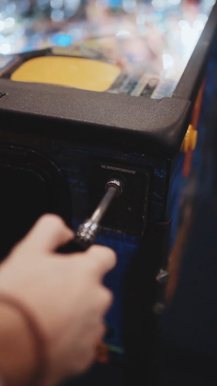 A Person Playing a Pinball Machine · Free Stock Video