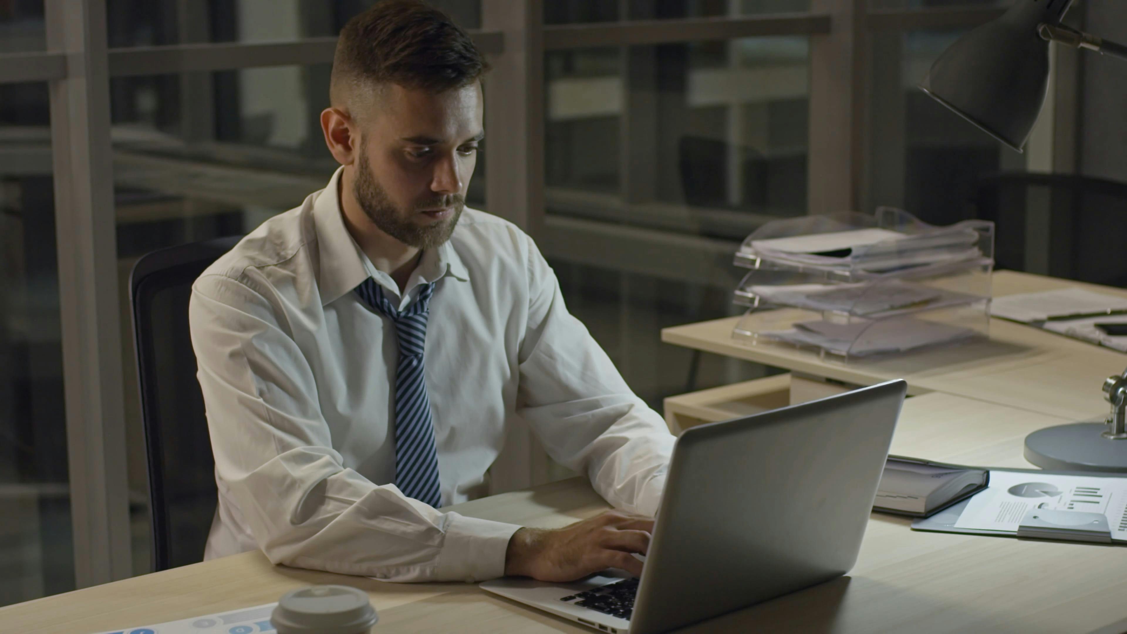 A Man Working On A Laptop Inside The Office · Free Stock Video