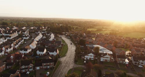 Drone Footage Of A Village Town Beside The Open  Fields