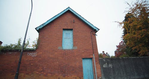 Wooden Doors On A House Made Of Bricks