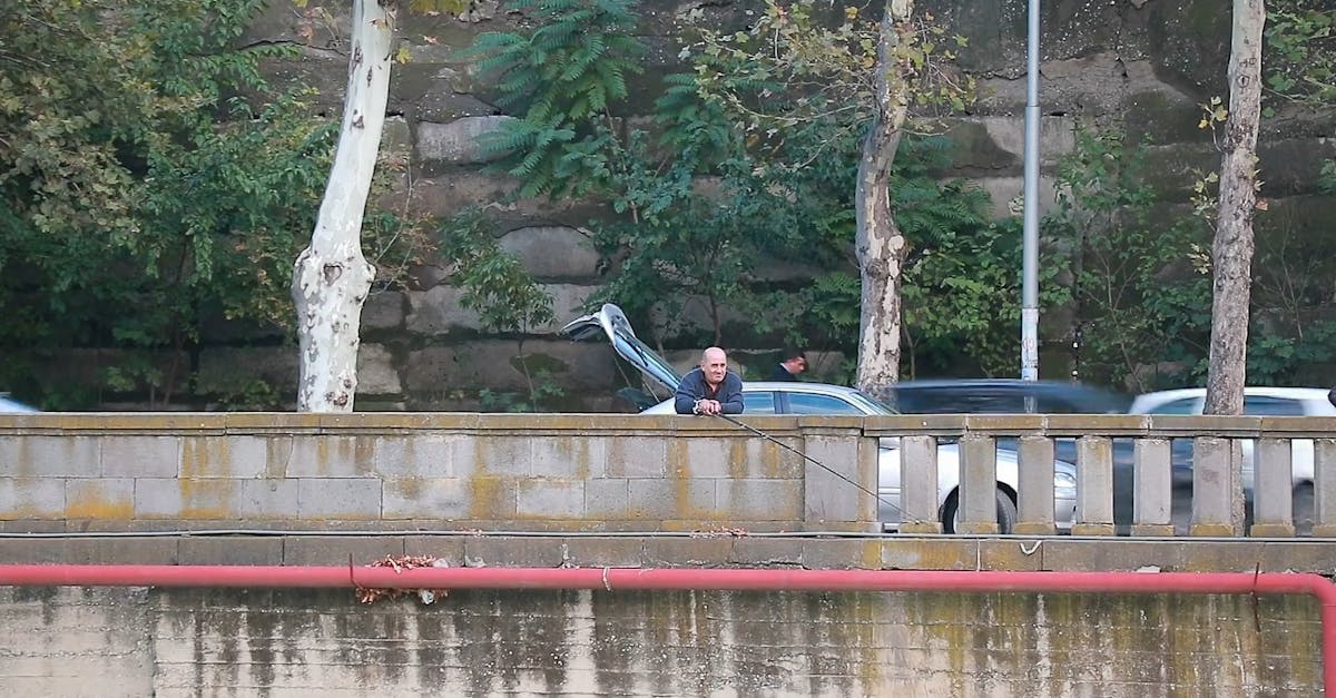 Man Doing Fishing On A Bridge · Free Stock Video