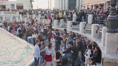 vibrant tourists gather at trevi fountain rome