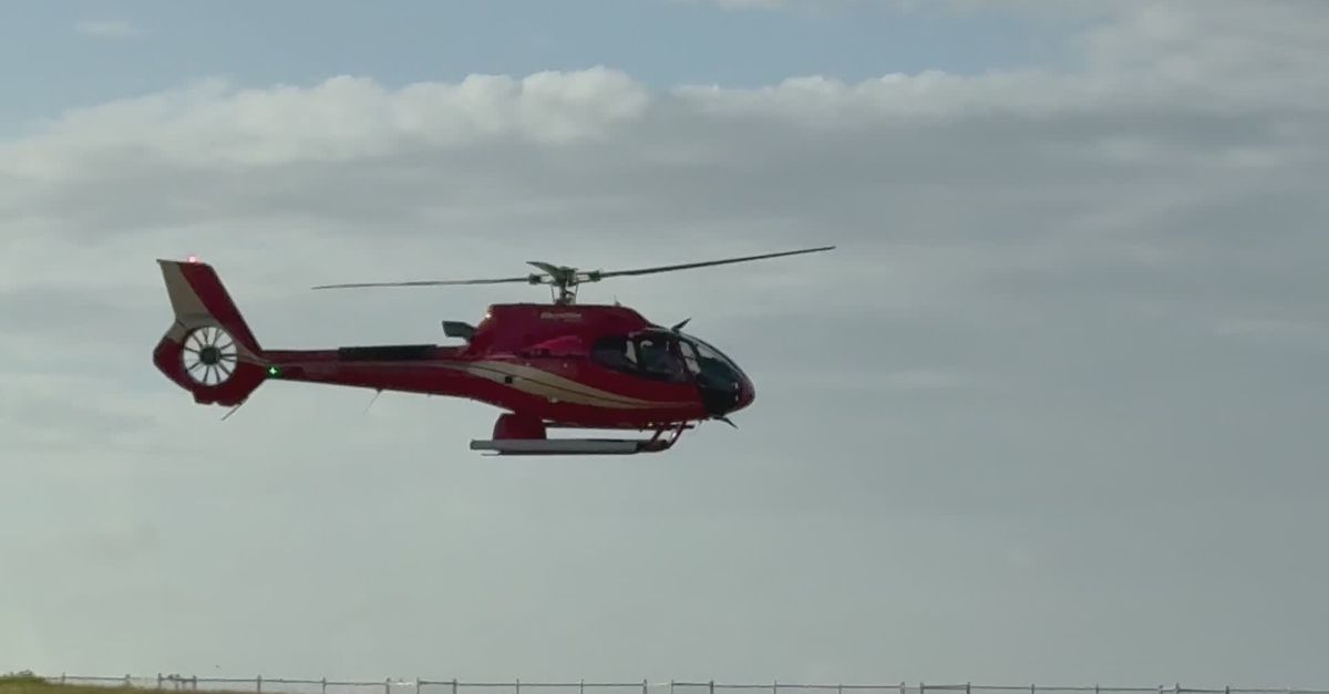 Red Helicopter Hovering Over Open Field Free Stock Video Footage ...