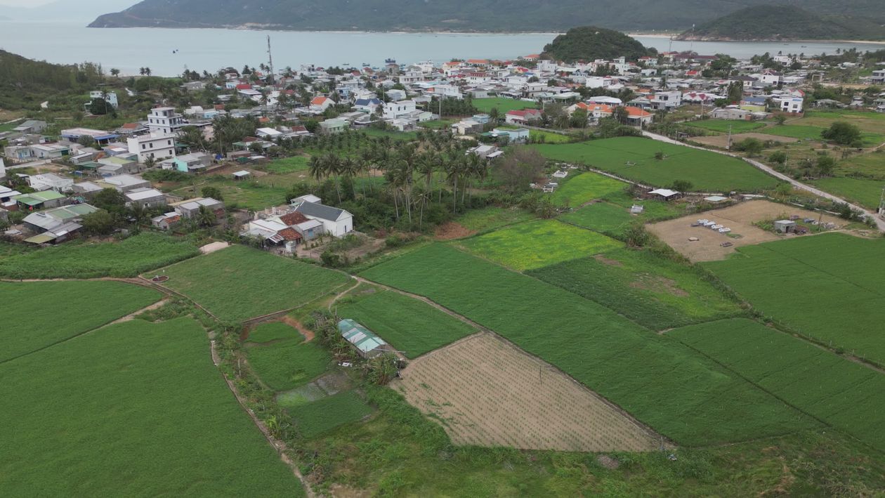 Aerial View of Coastal Town and Lush Fields Free Stock Video Footage ...