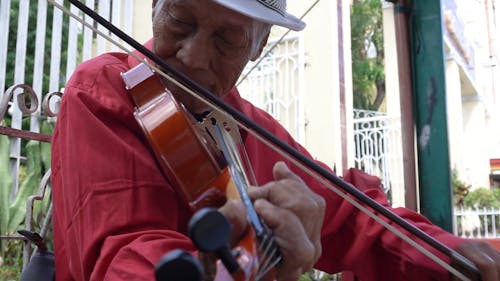 A Musician Playing The Violin