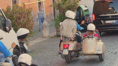 vintage scooter ride through rome streets