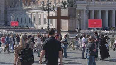 crowd at vatican city around large cross