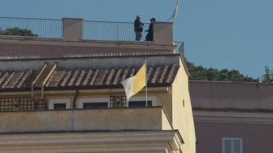vatican city rooftop with vatican flag