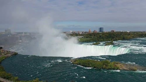 Mist Of Water  Is Rising Up From The The Force Of Niagara Falls