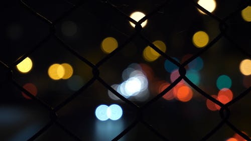 Wire Fence With Lights On Background