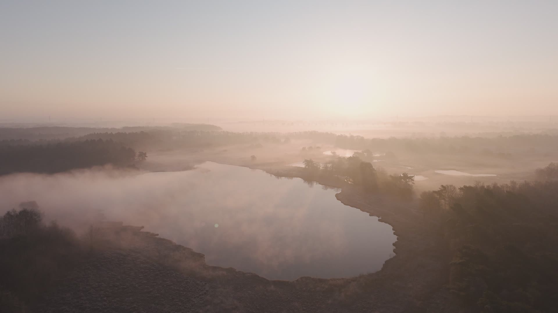 Serene Aerial View of Misty Lake at Sunrise Free Stock Video Footage ...