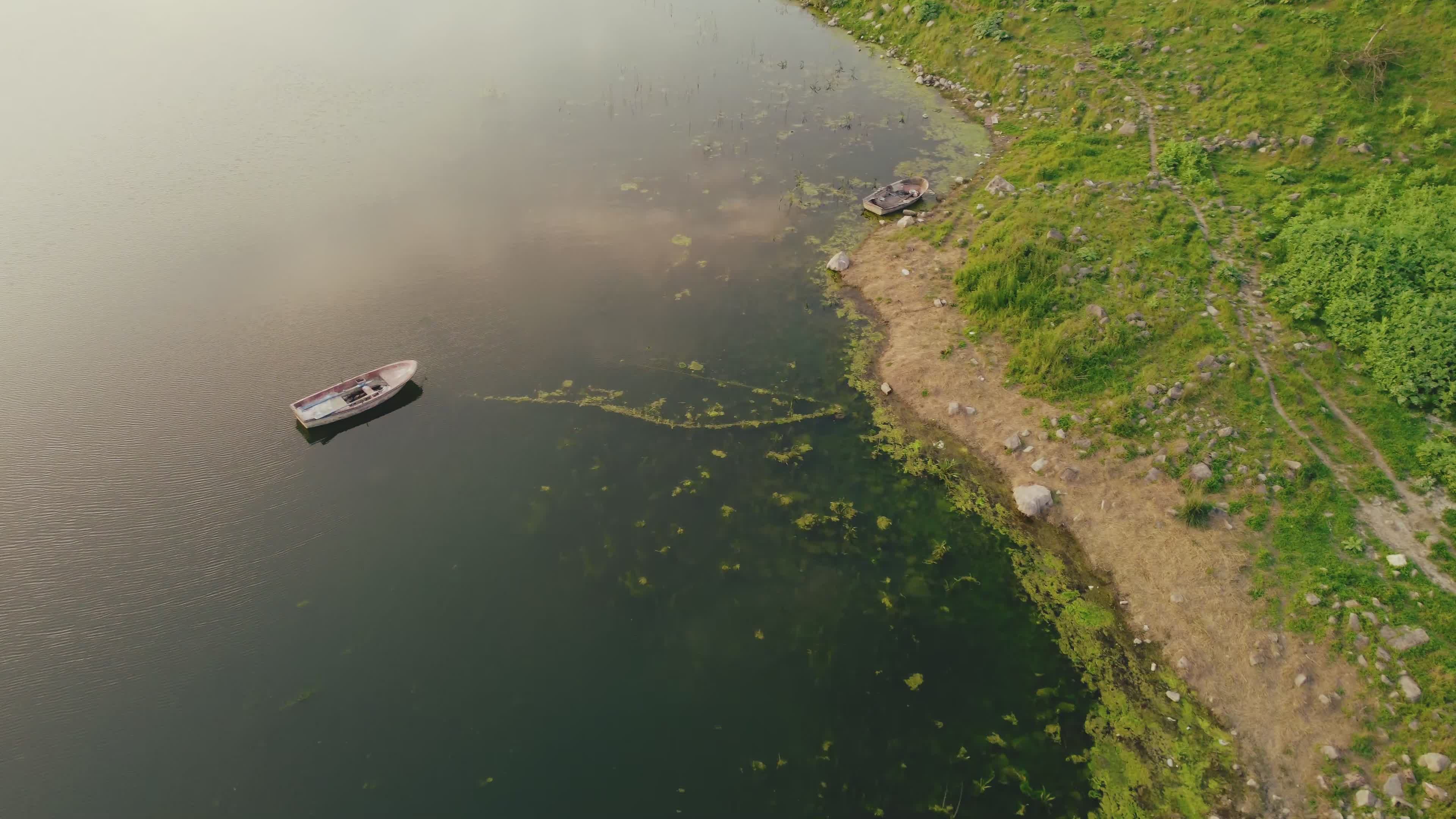 Aerial View of Serene Lake with Boat Free Stock Video Footage, Royalty ...