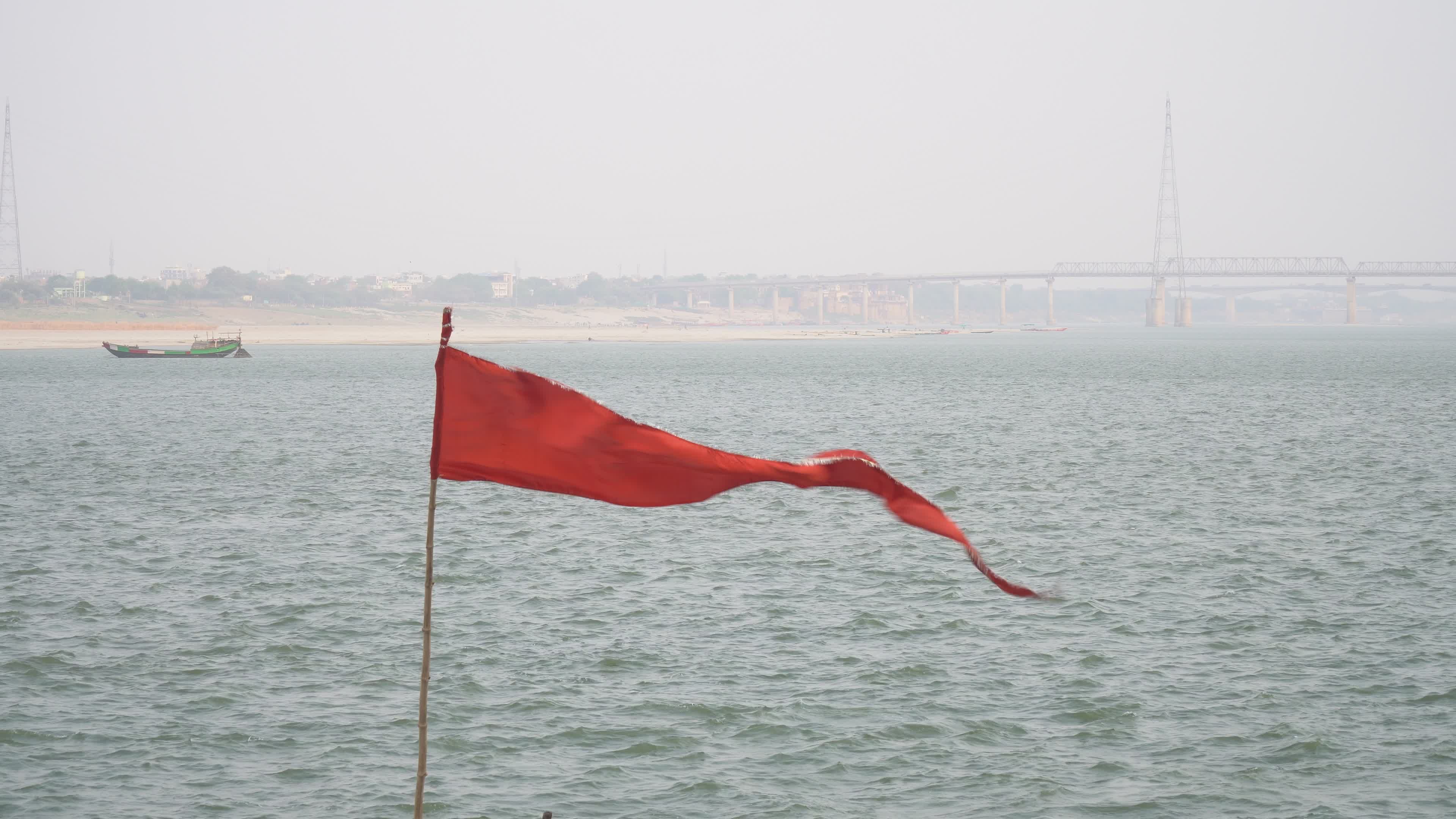 Majestic Red Flag Waving on Ganges Riverbank Free Stock Video Footage ...