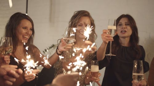 Group Of Women Holding Sparklers