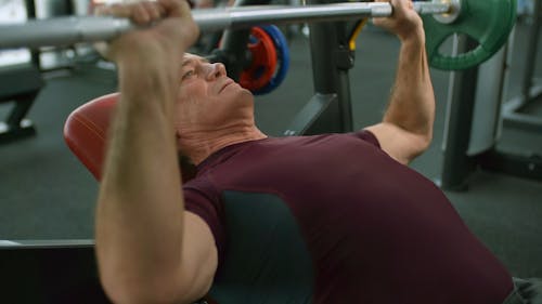 People In The Gym Lifting Dumbbells - Stock Video