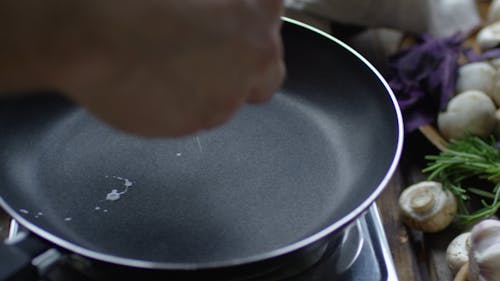 Person Cooking A Sunny Side-Up Egg