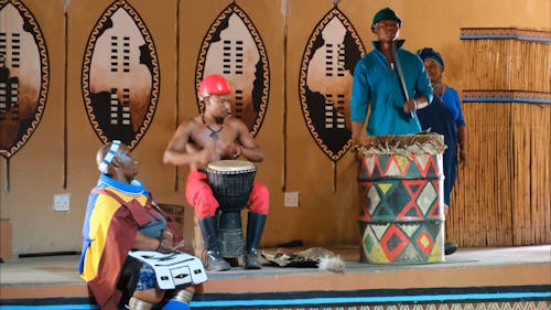 A Group Of Performers Performing Traditional African Music And Dances 