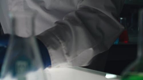 People Working On Liquids Inside A Laboratory