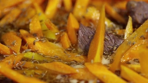 Sprinkling Flavored Powder On A Dish Of Squash And Beef