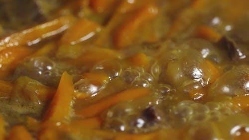 Boiling Squash Sticks On A Liquid Broth