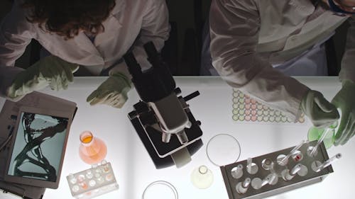 A Man And A Woman Doing Work In A Laboratory