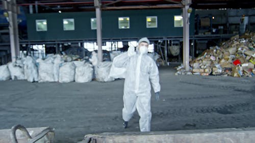 A Man Working In A Recycling Plant