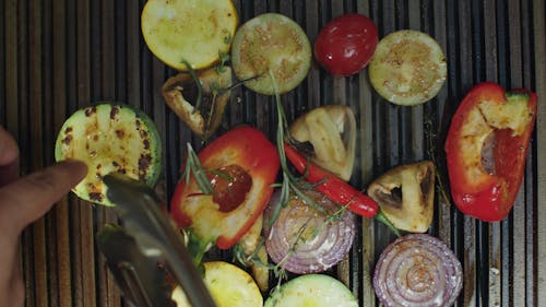 A Variety Of Vegetables Being Grilled