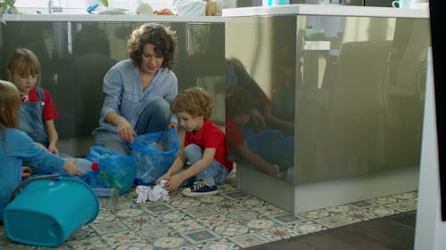 Mother Teaching Her Children About Environmental Care