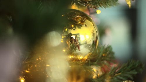 Santa Claus Reflection On A Christmas Tree's Ornaments Ball Decoration